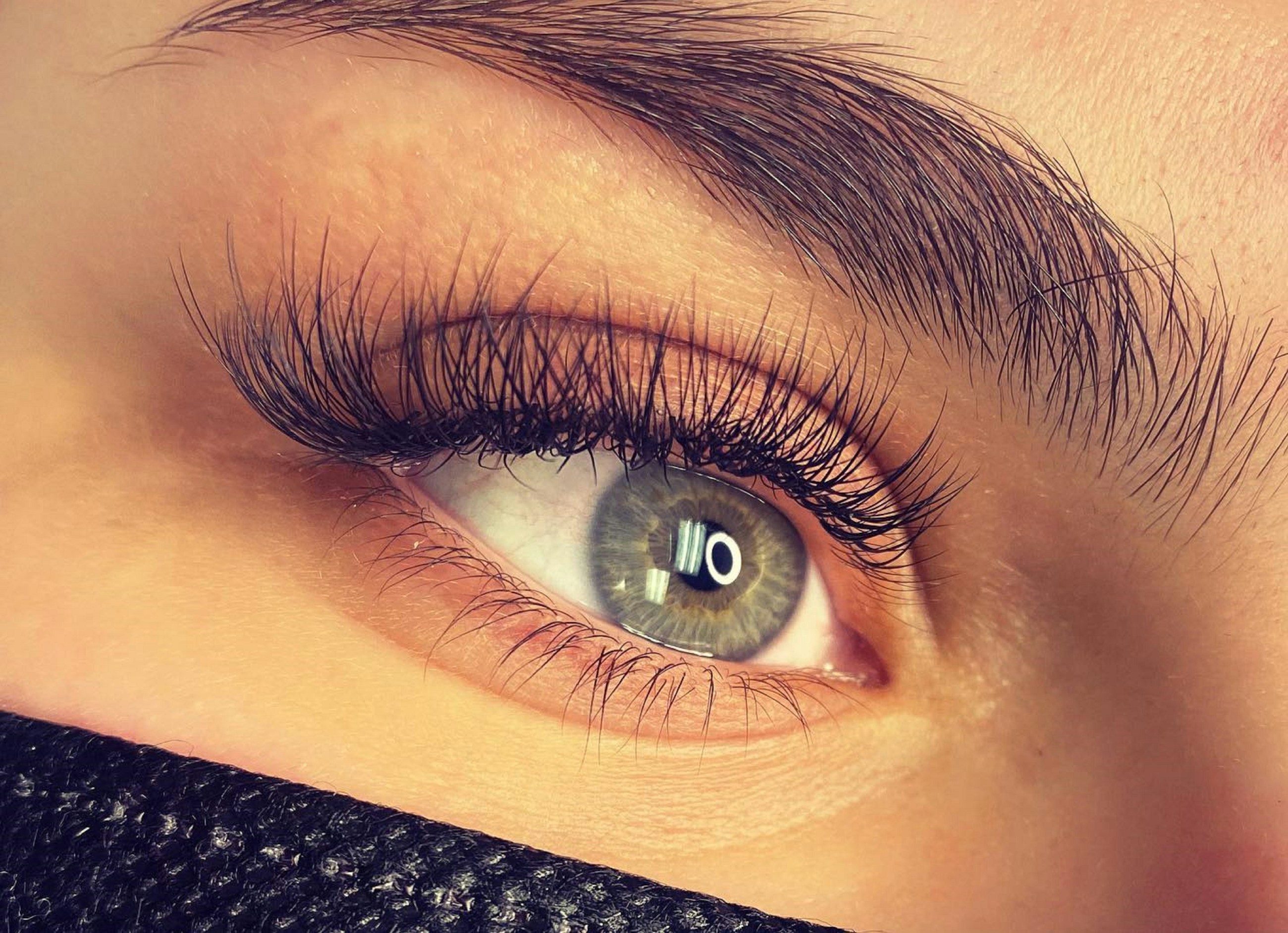 High fidelity placeholder close-up of finished lash extensions on a clean eye detail