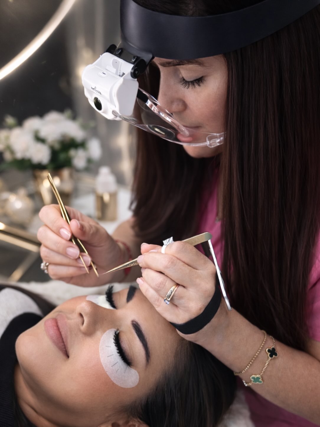 BeautifulClawz specialist applying lash extensions with precision tweezers